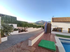 een uitzicht op een huis met een zwembad bij Only4you Country House Perfect location to visit Andalucia in Casabermeja