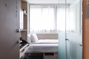 Voodi või voodid majutusasutuse Royal Jade Boutique Hotel toas
