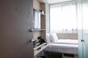 Voodi või voodid majutusasutuse Royal Jade Boutique Hotel toas