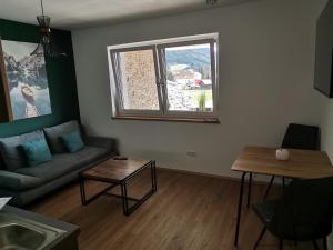Posezení v ubytování Berg:Zeit_Apartments