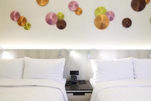 Voodi või voodid majutusasutuse Royal Jade Boutique Hotel toas