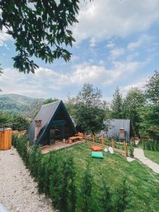 a house on a hill with a grassy yard at Loca Sapanca Bungalov in Sapanca