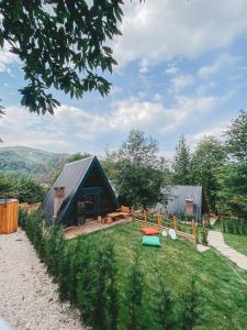 a house on a hill with a grassy yard at Loca Sapanca Bungalov in Sapanca +19 photos