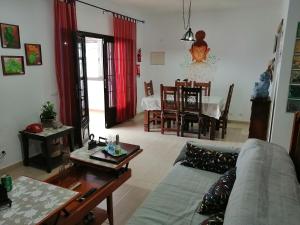 a living room with a couch and a table at Casa Tortuga in Costa Teguise