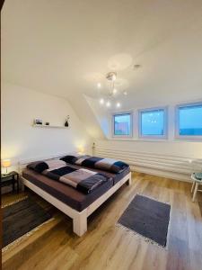 a bedroom with a large bed in a room at Ferienwohnung mit Fernblick in Hagen