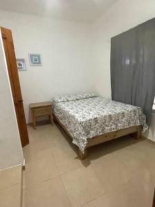 Ein Bett oder Betten in einem Zimmer der Unterkunft Casa Canephora