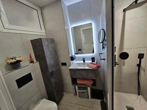 a small bathroom with a sink and a toilet at El Dorado 114 luxury with full air-conditioning in Playa de las Americas +35 photos