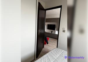 Una cama o camas en una habitación de T2 Face à la Mer & Village de Noël 5 min à pied