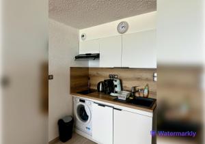 Una cocina o cocineta en T2 Face à la Mer & Village de Noël 5 min à pied