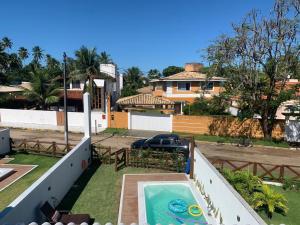 a view of the backyard of a house with a swimming pool at ILHA in Itaparica Town