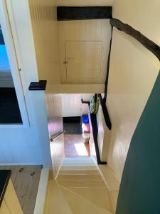 an overhead view of a staircase in a house at Bakers Cottage Ludham - Norfolk Broads in Ludham