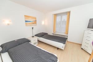 Llit o llits en una habitació de Hotel Rotes Haus