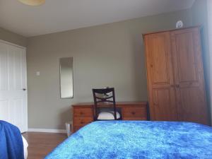 Cama o camas de una habitación en Holly Cottage Mayobridge