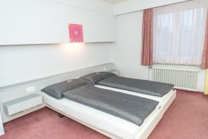 Llit o llits en una habitació de Hotel Rotes Haus