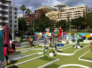 a group of people standing around in a park at Holiday & Relax - Appartament Center Torremolinos in Torremolinos