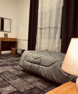 a bedroom with a bed sitting on the floor at Montana Inn in Wadi Musa