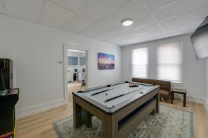 a living room with a pool table in it at Pet-Friendly Vacation Rental in Atlantic City! in Atlantic City