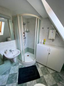 a bathroom with a shower and a sink at Chata pod Gerlachom in Vyšné Hágy