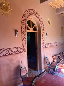 A bed or beds in a room at Riad Imuhar