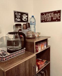 a kitchen with a shelf with a bowl of food at Montana Inn in Wadi Musa
