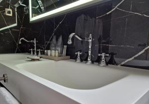 Kúpeľňa v ubytovaní Boutique Hotel Bora & Villas Garamm