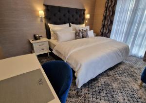 Posteľ alebo postele v izbe v ubytovaní Boutique Hotel Bora & Villas Garamm