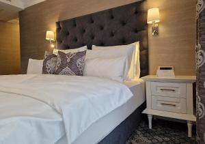 Posteľ alebo postele v izbe v ubytovaní Boutique Hotel Bora & Villas Garamm