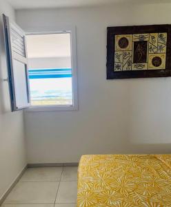 a bedroom with a window and a bed in a room at Résidence blue dream in Les Trois-Îlets
