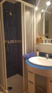 a bathroom with a shower and a sink and a shower at Casa Maite in Palamós
