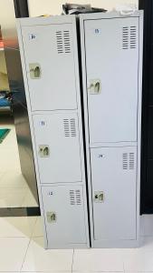 two white lockers sitting next to each other at Dubai Star Hostel in Dubai