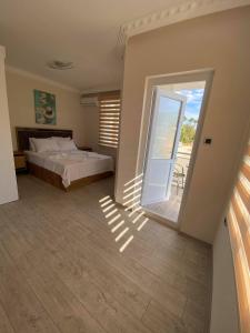 Кровать или кровати в номере Villa Maleyna