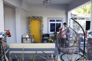 a man and a woman in a room with a yellow door at Rowena's River Resort 