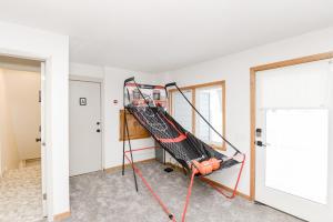 an empty room with a ladder in a house at NEW Remodeled Townhome Close to Downtown in Fargo