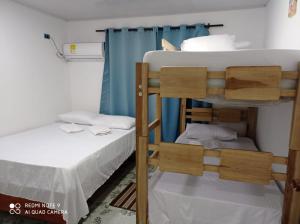 a couple of bunk beds in a room at Apartamentos AJ place 2 in San Andrés