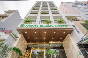 a building with a sign that reads minnir quan hotel at Minh Quan Hotel - Da Nang Center By HOS in Danang