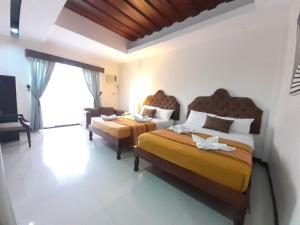 Postel nebo postele na pokoji v ubytování MelSol Hotel