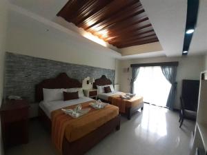 Postel nebo postele na pokoji v ubytování MelSol Hotel