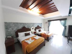 Postel nebo postele na pokoji v ubytování MelSol Hotel