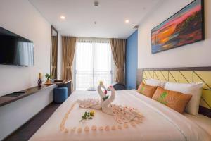 TV a/nebo společenská místnost v ubytování Minh Quan Hotel - Da Nang Center By HOS