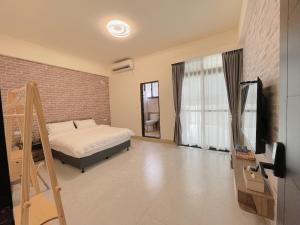 Postel nebo postele na pokoji v ubytování Suixiang B&B