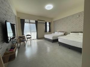Postel nebo postele na pokoji v ubytování Suixiang B&B