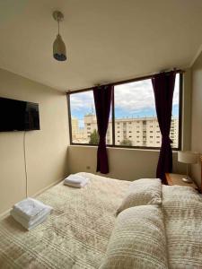 Postel nebo postele na pokoji v ubytování Espectacular vista al Mar en Avenida San Martin