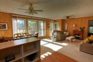 a living room with a couch and a table at Peaceful & Private Cabin close to the Lake in Matlock