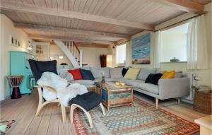 a living room with a couch and a table at Gorgeous Home In Glesborg With Wifi in Glesborg