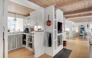 a kitchen with white walls and wooden ceilings at Gorgeous Home In Glesborg With Wifi in Glesborg