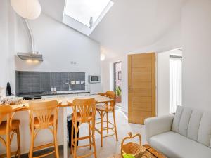 a kitchen and living room with a table and chairs at Alexander Z - Uk43586 in Ellesmere