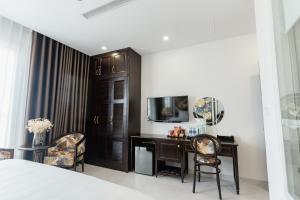 TV a/nebo společenská místnost v ubytování Royal Boutique Hotel Phu Quoc Island + 29 fotografií