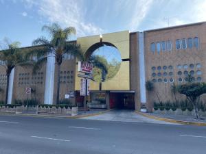 a large building with a building with a large window at HOTEL MARQUES DEL PEÑON in Mexico City