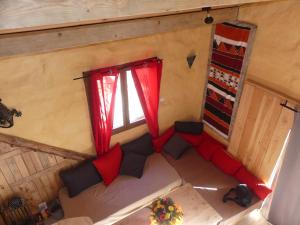 an overhead view of a living room with a couch and a window at Gite unique et piscine privative dans un écrin de verdure in Culmont