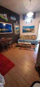 a living room with a bed and a red rug at OPEN SPACE in Augusta